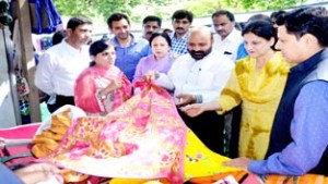 Minister for Social Welfare, Bali Bhagat flanked by Minister of State for Social Welfare Asiya Naqash inspecting a stall at Exhibition-cum-Sale at Srinagar.