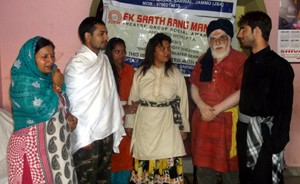 A scene from the play ‘Ghar Ki Hiffazut Zaroori Hai’ staged by ESRM in its Monday Theatre at Jammu.