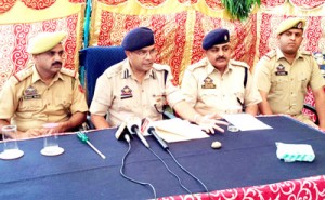 SSP Jammu Uttam Chand interacting with media persons at Jammu on Tuesday. SDPO East Mohammad Rafiq Manhas & SHO Channi Himmat Inspector Aejaz Wani are also seen in picture. -Excelsior/Rakesh