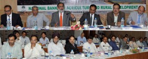 Finance Minister Dr Haseeb Drabu chairing State Level sensitization workshop at Srinagar on Wednesday.