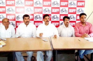 JKNPP chairman Harshdev Singh addressing a press conference at Jammu on Tuesday.