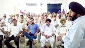 Manjit Singh addressing party workers at Vijaypur on Monday.