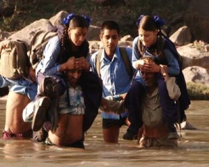 School children crossing Tawi river in absence of foot bridge.-Excelsior/ Vasu Gupta
