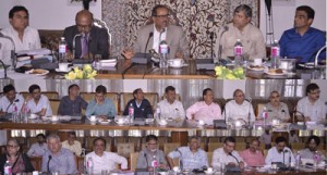 Deputy Chief Minister Dr Nirmal Singh chairing a meeting at Srinagar on Wednesday.