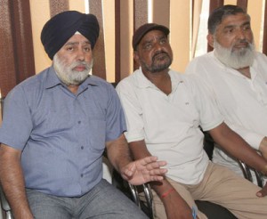 General Secretary, JKSRTC Workers Union, Jammu province, Paramjeet Singh, along with others addressing media persons at Jammu. -Excelsior/Rakesh
