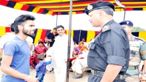 Brig Vikram Kumar, Commander, Sabre Brigade interacting with people during medical camp at Ratnuchak on Sunday.