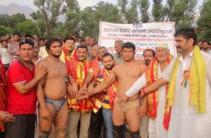 Dignitaries complementing winner and runner-up wrestlers of 2nd Salal Kesari Dangal