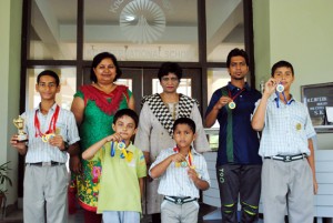 Skaters of KCIS posing for a group photograph alongwith Principal, Maya Mishra, Activity Coordinator, Rajni Malhotra and coach, Rajiv Kalotra.