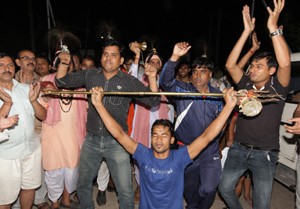 Jubilant yatris dancing at Bhagwati Nagar Yatri Niwas, Jammu before leaving for holy cave on Wednesday. — Excelsior/Rakesh