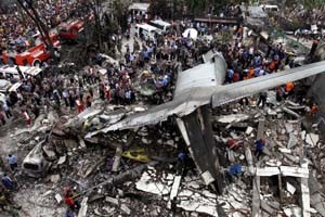 Security forces and rescue teams examine the wreckage of an Indonesian military C-130 Hercules transport plane after it crashed into a residential area in the North Sumatra city of Medan, Indonesia on Tuesday. (UNI)