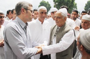 Chief Minister Mufti Mohammad Sayeed and former Chief Minister Omar Abdullah exchange greetings after Eid prayers in Srinagar on Saturday.