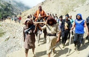 Amarnath Yatris on way to holy cave on Wednesday. — Excelsior / Sajad Dar