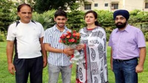 Principal Government Polytechnic, Jammu, Er Ritu Jamwal felicitating fencer Vansh Mahajan after returning from South Africa.