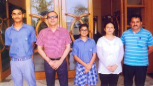 KCPS students posing along with School Principal, Amarendra Kumar Mishra, Swimming Coach and Sports Incharge.