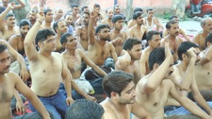 Semi-naked PHE workers staging protest on Wednesday.