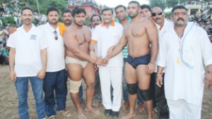 Wrestlers Birju and Benia Min being felicitated by Shiv Kumar Sharma and other dignitaries in Jammu on Monday.