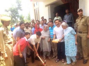 MoS Finance Pawan Gupta kick starting work for construction of a lane in Udhampur on Sunday.