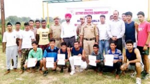 Winners of District Athletics Championship posing for group photograph.