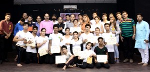 Artists posing along with experts during concluding function of workshop at GCW Parade in Jammu.