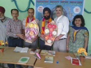 Dogri writers Yashpaul Nirmal and Popinder Singh Paras being honoured at a function in Kathua on Sunday.