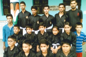 Selected players of Pencak Silat State team posing for a group photograph.