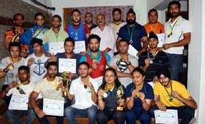 Winners in various categories of State Power Lifting Championship posing for a group photograph with BJP leader, Yudhvir Sethi at Jammu.