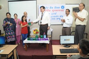 General Manager, SBI Zonal Office, Jammu, Arvind Priya, distributing gifts among children during a function at Jammu.