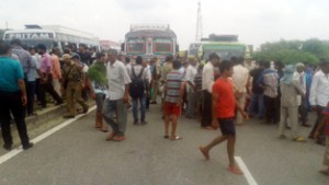 People protesting at Ghagwal on Tuesday. -Excelsior/ Gautam