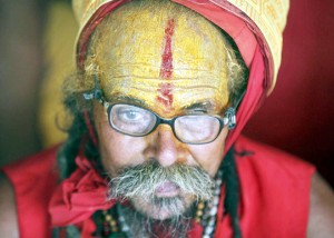 A sadhu waiting for registration in front of a counter at Jammu on Saturday. (UNI)