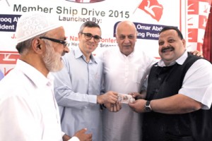 National Conference president Dr Farooq Abdullah with his son and NC Working President, Omar Abdullah,General Secretary Ali Mohammad Sagar and Provincial President (Jammu) Devendra Singh Rana during the launch of party’s membership 2015 at Nawa-e-Subh complex in Srinagar. -Excelsior/ Amin War