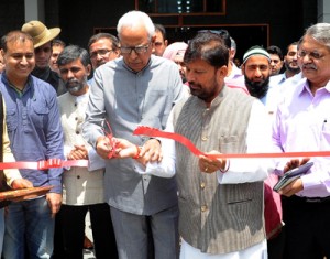 Governor N N Vohra flanked by Minister for Health, Ch Lal Singh launching Ambulance Service at SKICC on Monday.