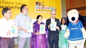 Minister for Finance, Dr Haseeb Drabu flanked by MoS Social Welfare Asiya Naqash during children's theatre festival at Srinagar on Wednesday.