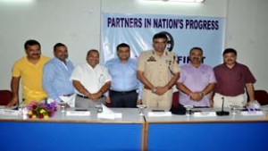 Regional Passport Officer, Rajinder Gupta, flanked by CCI office bearers during felicitation function in Jammu on Friday.