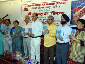 Vice Chancellor of JU,  Prof RD Sharma and others releasing Dogri book ‘Nav-Geet’ during function in Jammu on Tuesday.
