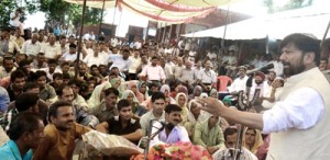 Minister for Health, Ch Lal Singh addressing public gathering at Jankhar on Monday.