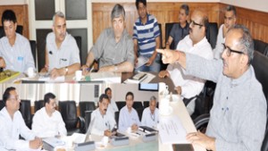 Deputy Chief Minister, Dr Nirmal Singh chairing a meeting at Srinagar on Wednesday.