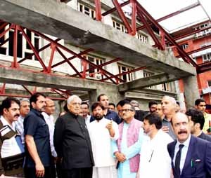 Chief Minister, Mufti Mohd Sayeed flanked by DyCM, Dr Nirmal Singh, Minister for Health, Ch Lal Singh during visit to Sopore town on Thursday.