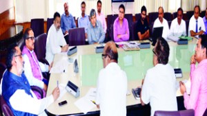 Deputy Chief Minister Nirmal Singh chairing a meeting at Srinagar on Friday.