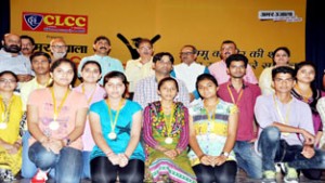 Deputy Chief Minister Dr Nirmal Singh along with other ministers and Speaker posing for a group photograph with meritorious students at Jammu on Sunday.