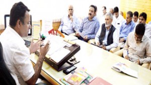 Minister for CA&PD, Choudhary Zulfkar Ali chairing a meeting at Srinagar on Thursday.