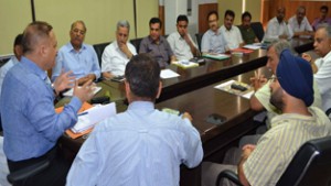 Divisional Commissioner Jammu Dr Pawan Kotwal chairing a meeting at Jammu on Saturday.