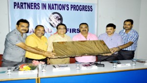 Outgoing Principal Commissioner of IT A K Thatai being felicitated by CCI members in Jammu on Thursday.
