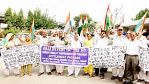 PoJK DPs staging protest near Press Club in Jammu on Thursday.  	        -Excelsior/ Rakesh 
