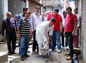 PCC gen secy Vikram Malhotra kick-starts lane repair work at Pacci Dakki in Jammu East.
