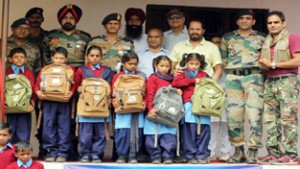 Students posing alongwith dignitaries during inaugural function of Primary School at Satoi in Reasi on Monday.  
