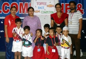 Winners of Toffee Race competition posing for a group photograph at R M Public School on Saturday.
