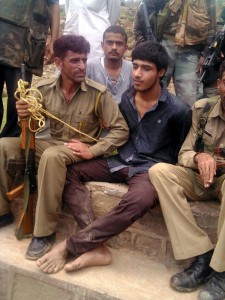 Pakistani militant Naved in custody of VDC members and local people at Narsu, Samroli on Wednesday. More pics on page 3.  -Excelsior/Rakesh