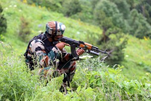 A trooper takes position in Nowgam sector on Tuesday.  —Excelsior/Aabid Nabi