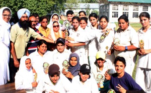 Jubilant Women’s College MA Road Cricket team posing for a group photograph alongwith Principal in Srinagar.