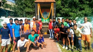 Hockey players and coaches celebrating National Sports Day at KK Hakhu Astroturf Stadium in Jammu on Saturday.